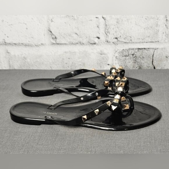 Streetwear Society Black Jelly Flip Flops with Brass Studs on the Bows. - Picture 3 of 9